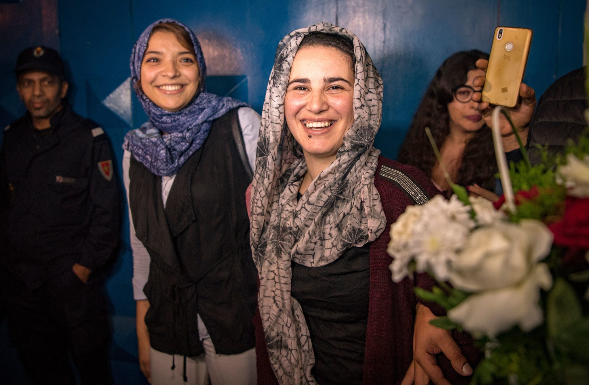Moroccan journalist Hajar Raissouni (R) is greeted upon leaving a prison in Sale near the capital Rabat on October 16, 2019. - Raissouni who was sentenced to one year in jail for an 