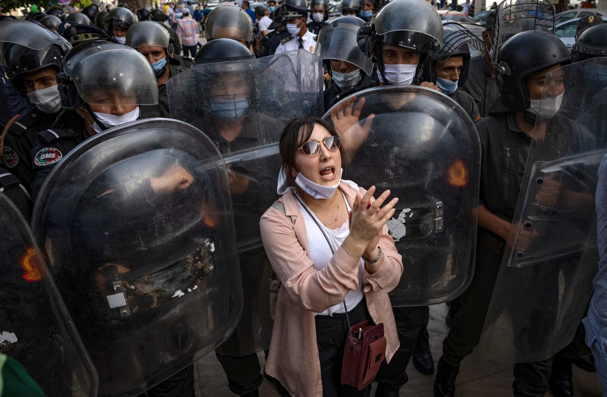 TOPSHOT - A Moroccan activist chants slogans during a protest demanding the release of Moroccan journalist Soulaimane Raissouni, who was sentenced to five years in prison for 