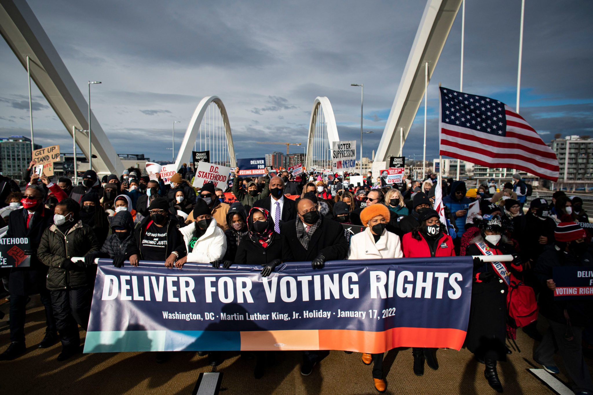 Martin Luther King III, center, Yolanda Renee King, and Arndrea Waters King, left, walk across the Frederick Douglass Memorial Bridge during the annual Martin Luther King Jr. Memorial Peace Walk in Washington, D.C., U.S., on Monday, Jan. 17, 2022. The family of the late Reverend Martin Luther King Jr. today is calling on the Senate and President Biden to enact federal voting rights legislation. Photographer: Al Drago/Bloomberg via Getty Images