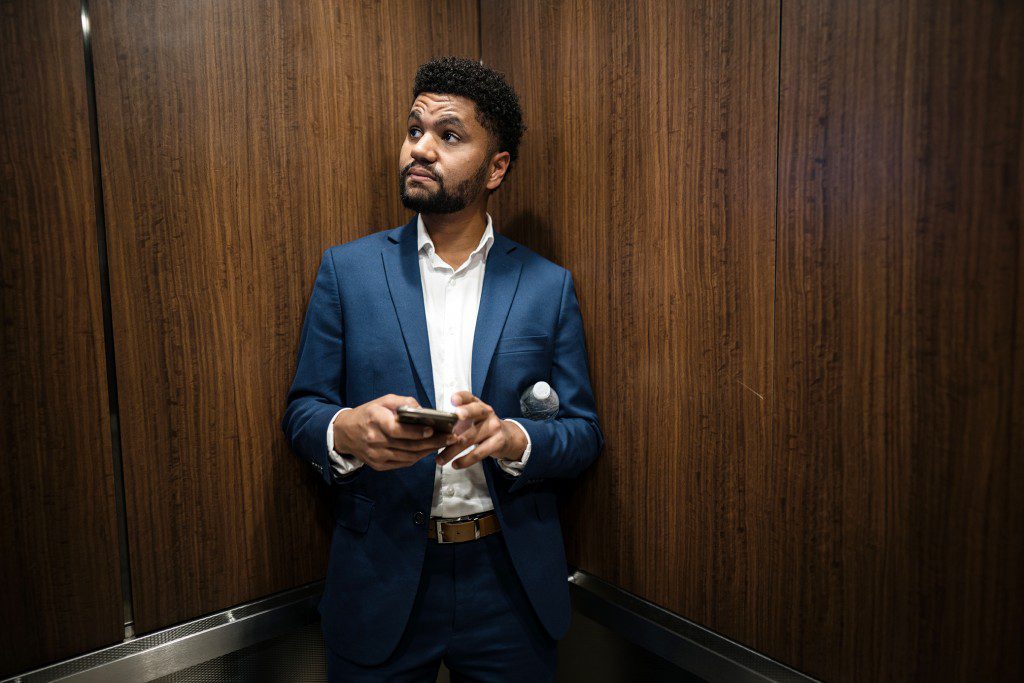 Maxwell Frost rides an elevator on his way to be interviewed on a podcast in Orlando, Fla. Frost is an Uber driver and Gen Z candidate for Florida's 10th congressional district. He won a crowded democrat primary and is favored to win the general election in a heavily blue district. (Photo by Thomas Simonetti for The Washington Post via Getty Images)