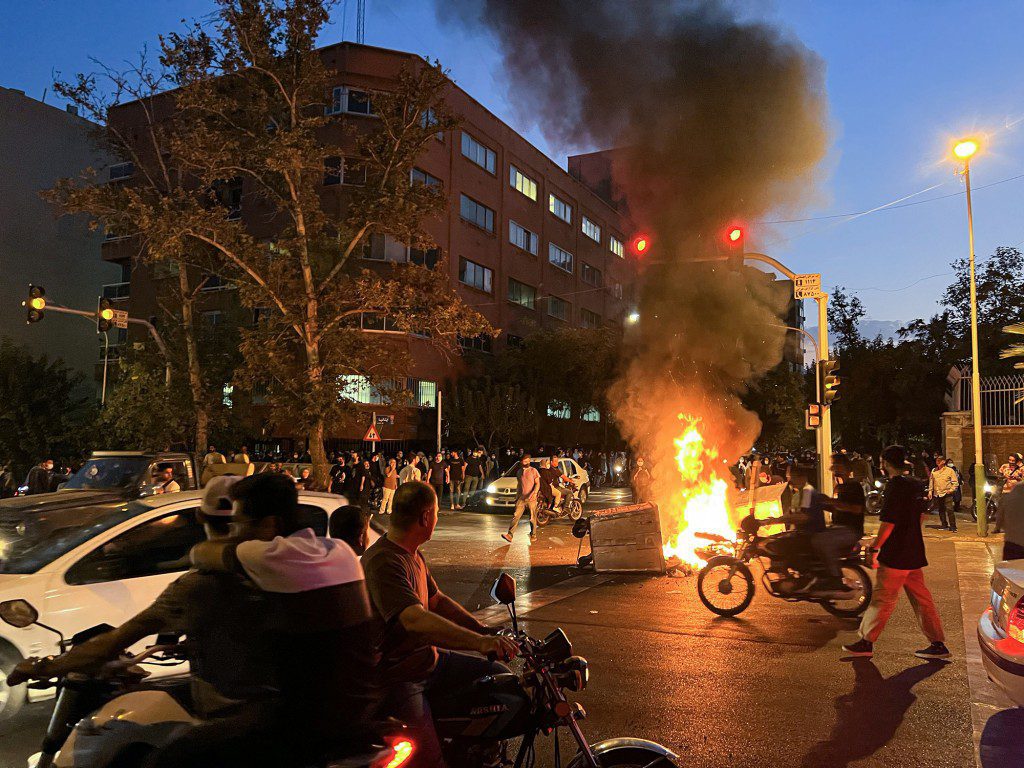 TEHRAN, IRAN - SEPTEMBER 19: People gather during a protest for Mahsa Amini, who died after being arrested by morality police allegedly not complying with strict dress code in Tehran, Iran on September 19, 2022. (Photo by Stringer/Anadolu Agency via Getty Images)