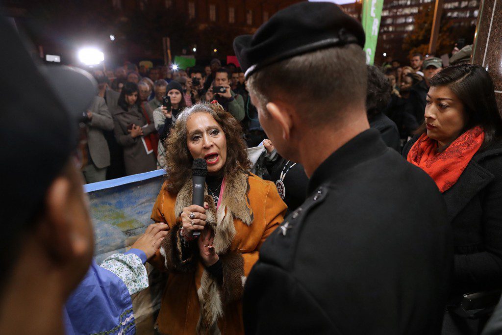 WASHINGTON, DC - NOVEMBER 15:  LaDonna Brave Bull Allard (C) of Cannon Ball, North Dakota, talks with Maj. Gen. Donald Jackson of the Army Corps of Engineers during a demonstration against the proposed Dakota Access Pipeline outside the Corps headquarters November 15, 2016 in Washington, DC. Allard's father and son are both buried on a hillside overlooking the confluence of the Cannon Ball and Missouri rivers and she asked Jackson to block the proposed pipeline. Organizers held a national day of action to call on President Barack Obama and the Army Corps of Engineers to permanently reject the pipeline before President-elect Donald Trump takes office.  (Photo by Chip Somodevilla/Getty Images)
