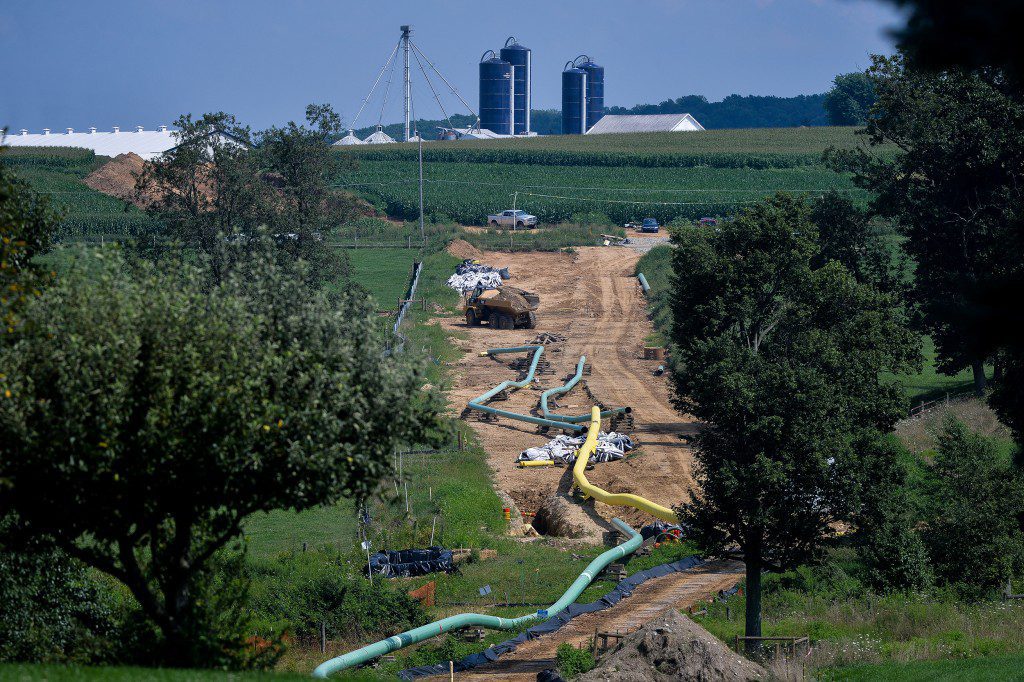 Sections of pipe sit near a farm at an Energy Transfer Partners LP construction site for the Sunoco Inc. Mariner East 2 natural gas liquids pipeline project near Morgantown, Pennsylvania, U.S. on Aug. 4, 2017. The Pennsylvania Department of Environmental Protection has issued four notices of violation after 